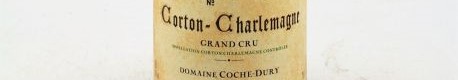 The picture shows a bottle of Corton Charlemagne wine from Coche Dury