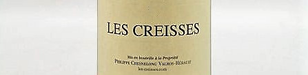 La photo montre une bouteille de vin de l'appellation Côteaux du Languedoc du domaine Les Creisses dans le Languedoc Roussillon.