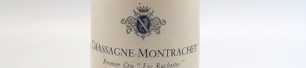 the picture shows a bottle of Chassagne Montrachet wine, Burgundy